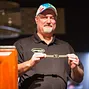 Tom Schneider displays his gold bracelet