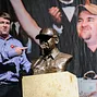 Chris Moneymaker posing with the commemorative bust