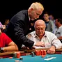 TD Robbie Thompson counts out Eliyahu Levy chips after he tripled up.  Tomas Trampota, left, is the contributor of the chips.