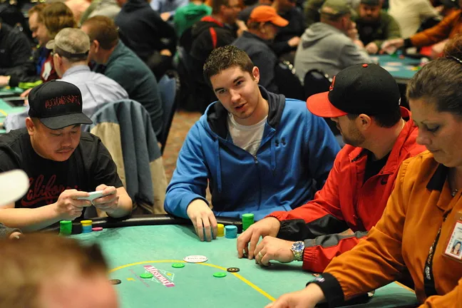 Blair Hinkle (center) has fought his way back from a tiny stack.