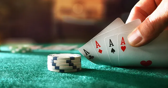 Four aces and poker chips