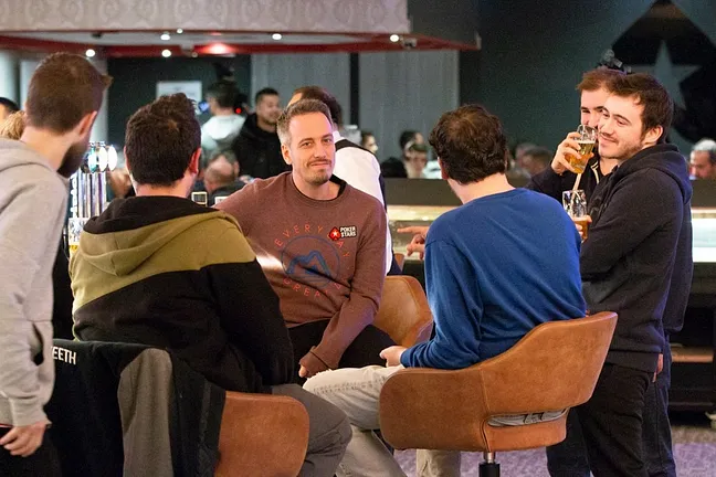 Lex Veldhuis at the bar with community members