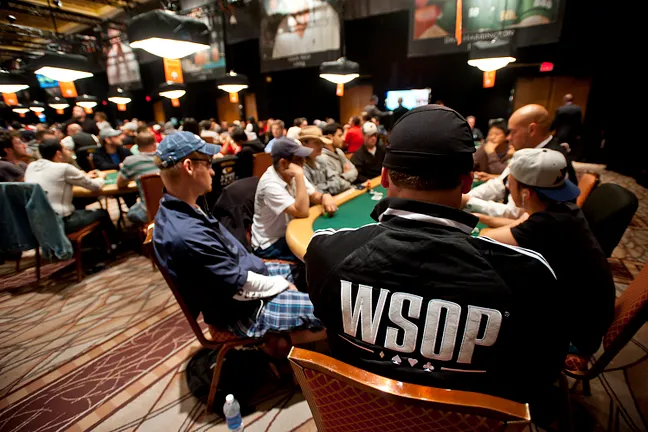 A player wears a WSOP jacket while competing in Event 03B