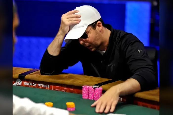 Poker player thinking at the table