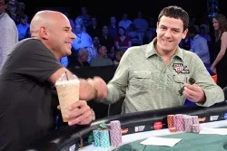 Guy Laliberte (left) and Carlos Mortensen shake hands before the final table begins