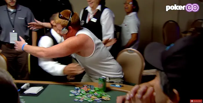 Phillips hugs the dealer after delivering the worst bad beat in WSOP history
