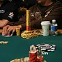 Dueling Chip Stacks: Joe Pharo's crystals cap his chips in the foreground while Carlos Mortensen has built a tower of chips in the background