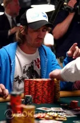 After the hand, the dealer counts Ludovic Lacay's chips to determine how much Hamid Nourafchan owes